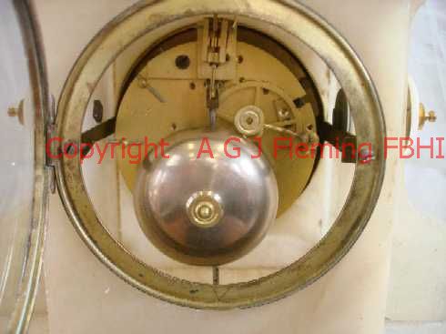 Back of mechanism of Alabaster clock with dish