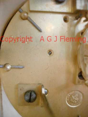 Stamps on back plate of Alabaster clock with dish