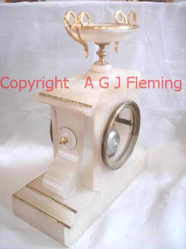 Right and back view of Alabaster clock with dish