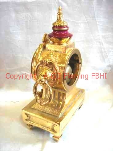 Rear and right side of gilt mantel clock