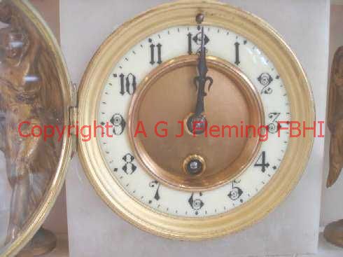 Dial of Alabaster clock with statues, glazed bezel open