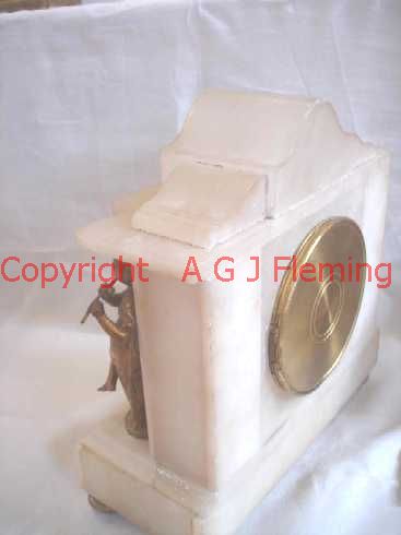 Right and back view of Alabaster clock with statues