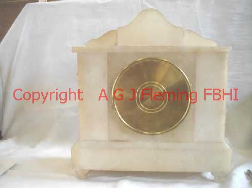 Back view of Alabaster clock with statues, rear cover closed