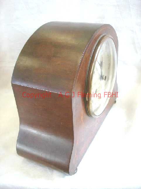 Left side view of mantel clock with German rack strike on gong movement