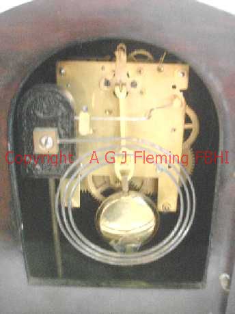 Inside view of mantel clock with German rack strike on gong movement